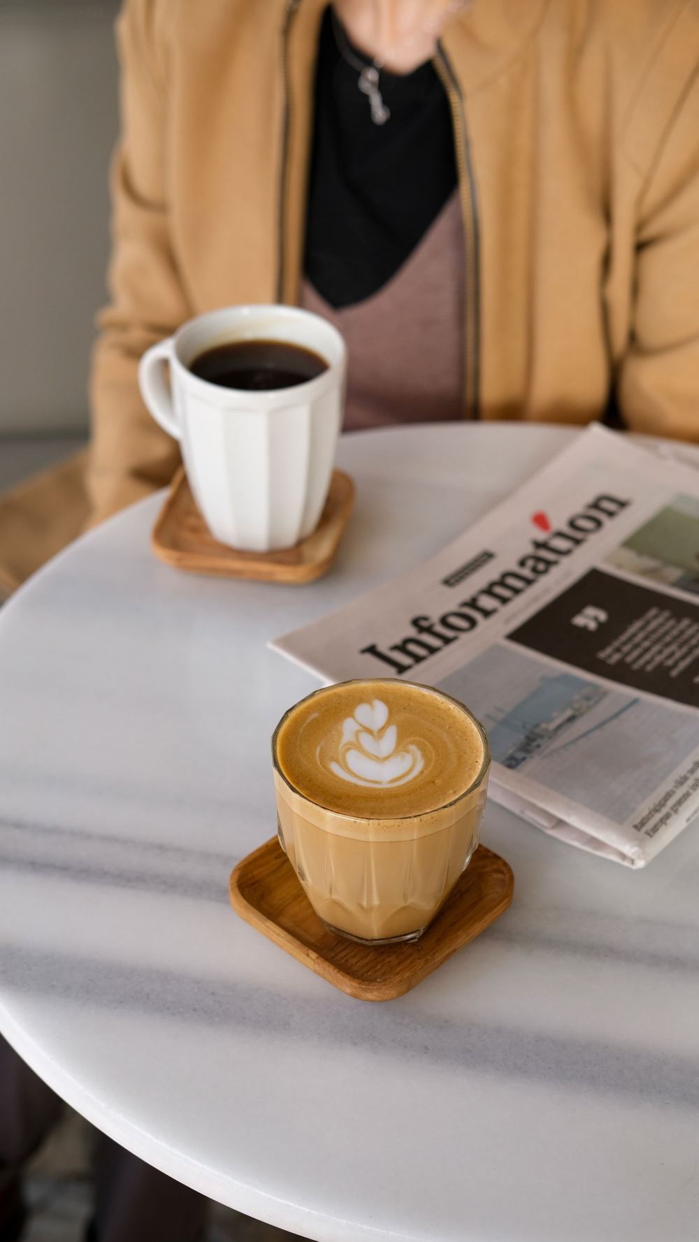 Local newspaper on a café table, the kind of print advertising co-op programs reimburse