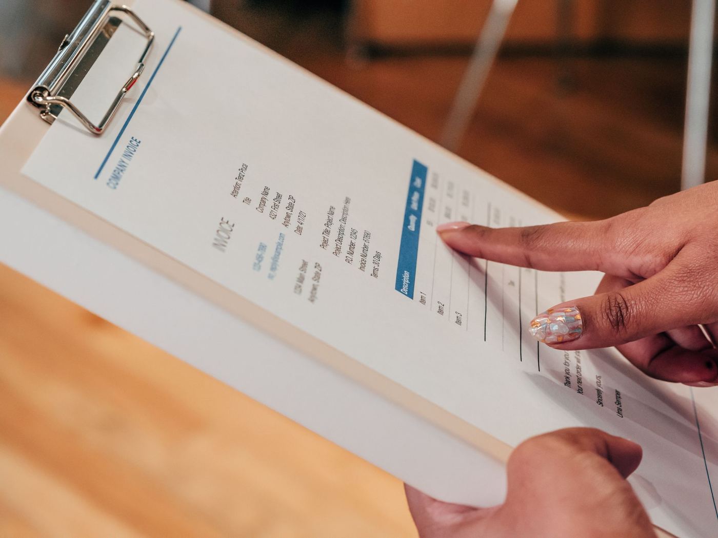 Reviewing an install invoice on a clipboard before filing